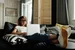 Photo of woman sitting on a couch 4100959