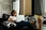 Photo of woman sitting on a couch 4100959