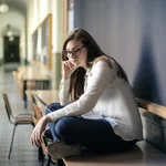 Woman in white long sleeve shirt and blue denim jeans 3776181