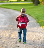 Child with schoolbag lost school things