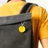 Chipolo ONE Yellow item finder attached to a backpack